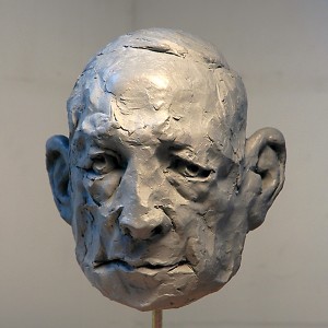 photograph of clay figurative sculpture of old man's head
